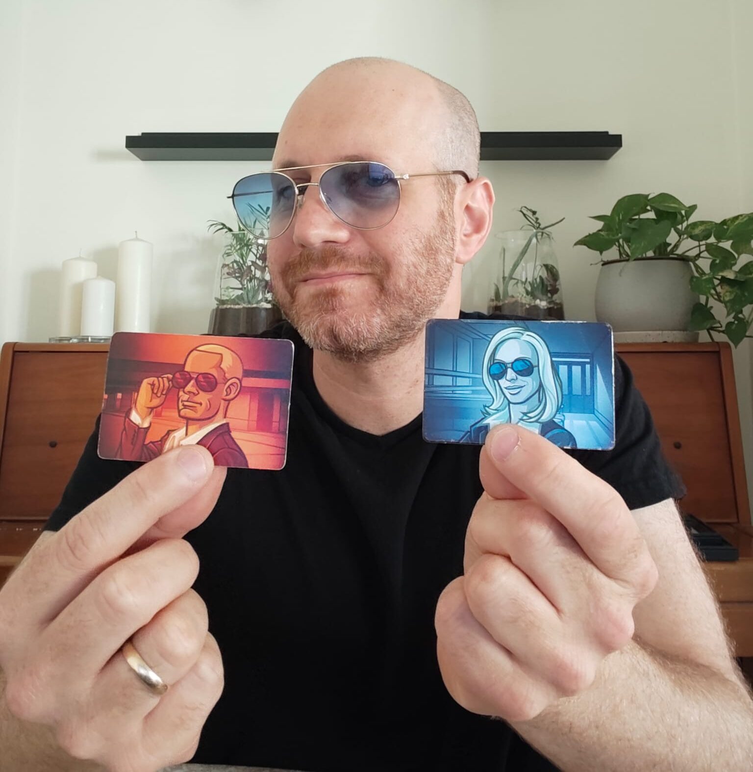 Eli from Blue Dragon Board Games holding his own copy of Codenames