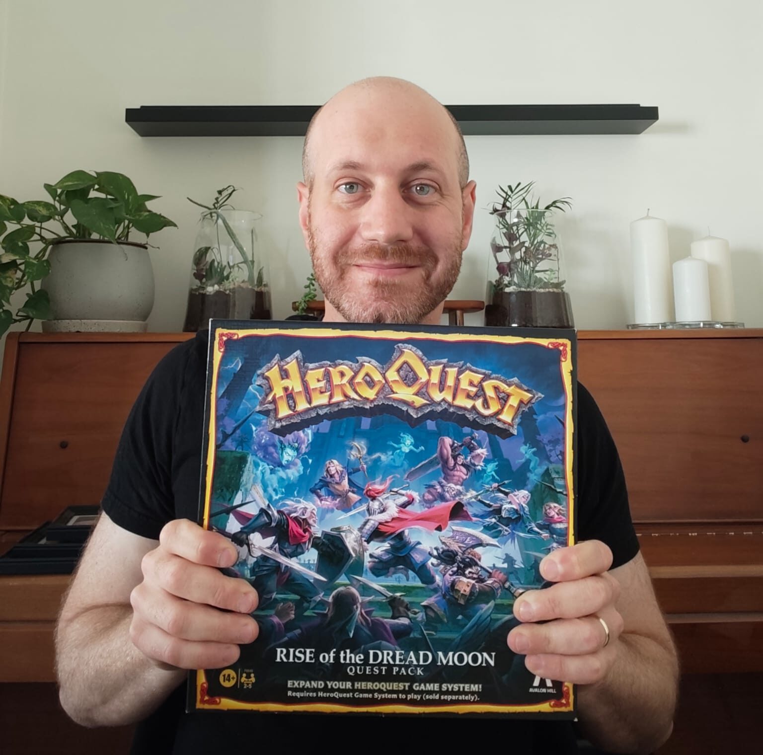 Eli from Blue Dragon Board Games holding his own copy of HeroQuest Rise of the Dread Moon