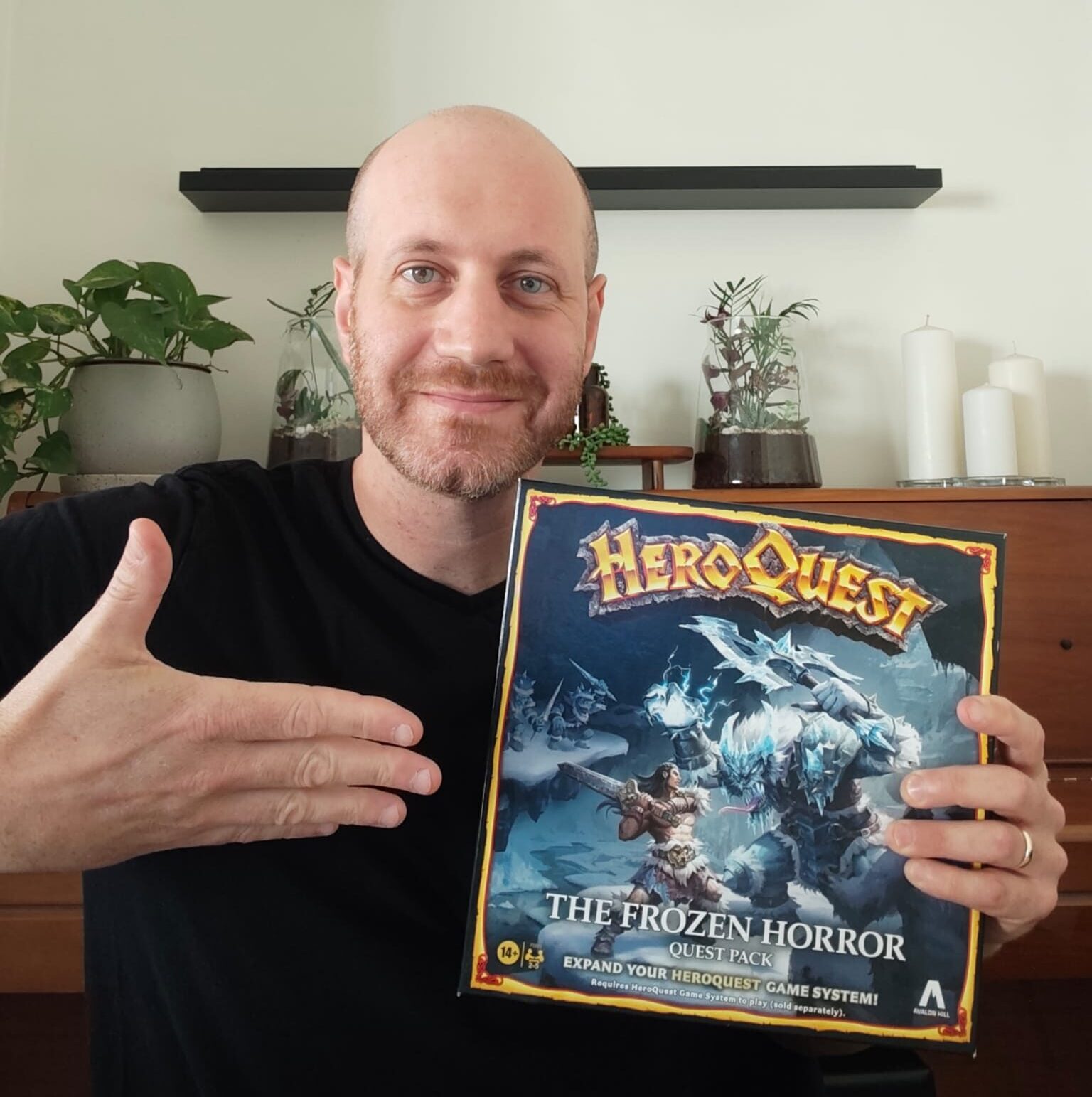 Eli from Blue Dragon Board Games holding his own copy of HeroQuest The Frozen Horror
