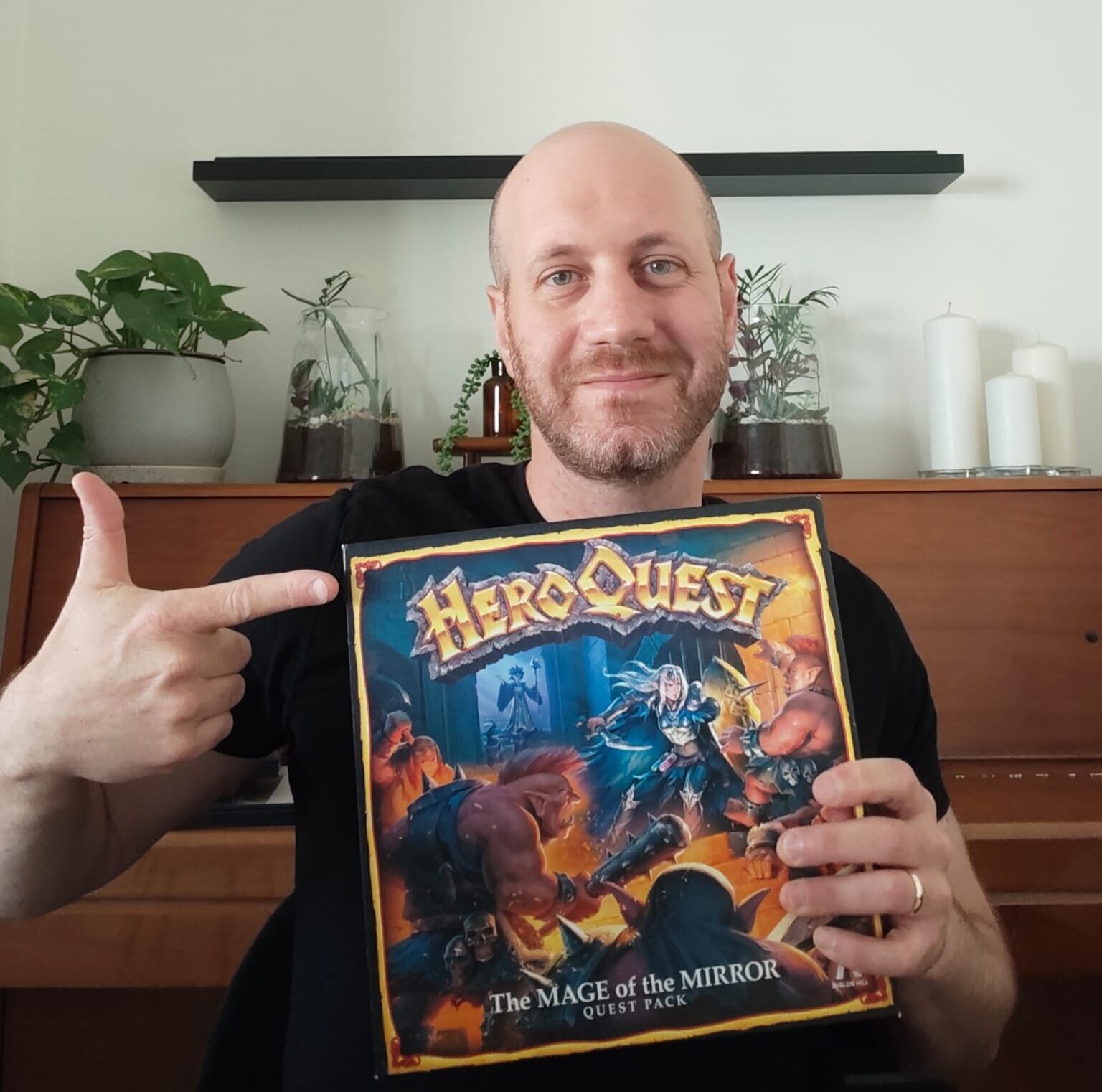 Eli from Blue Dragon Board Games holding his own copy of HeroQuest Mage of the Mirror
